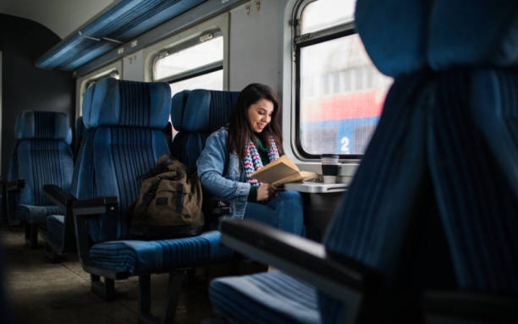 Women reading book on the train