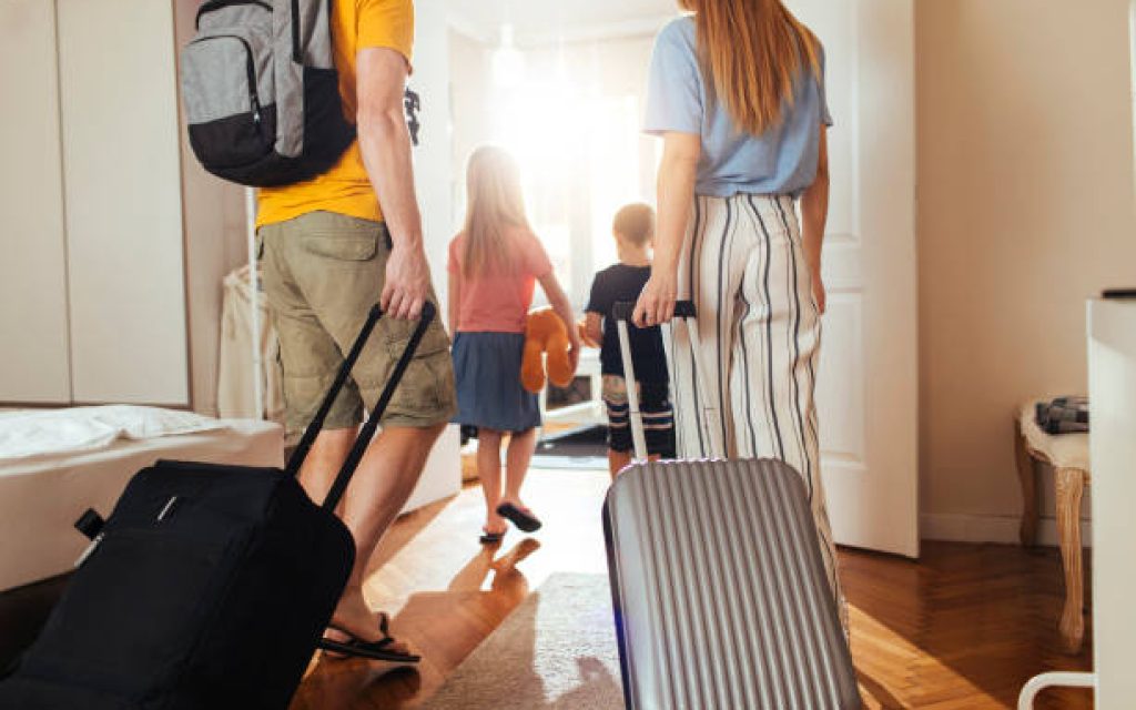 Shot of a happy family leaving their home for a vacation